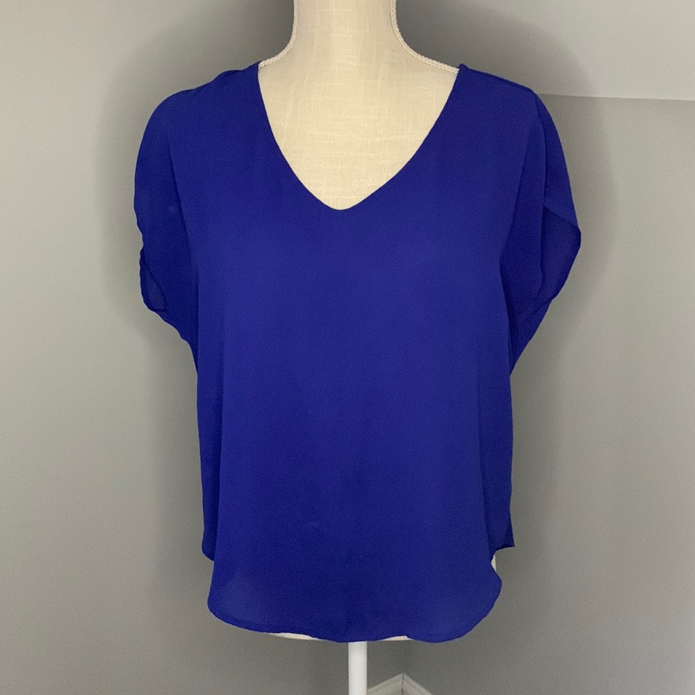 Woman top ,blue color, light used.